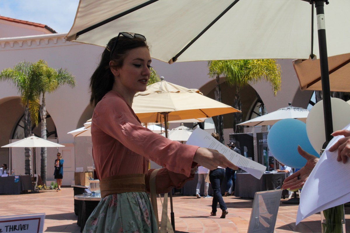 Haley Howard hands her résumé to a hotel manager Wednesday during Visit Santa Barbara’s job fair.